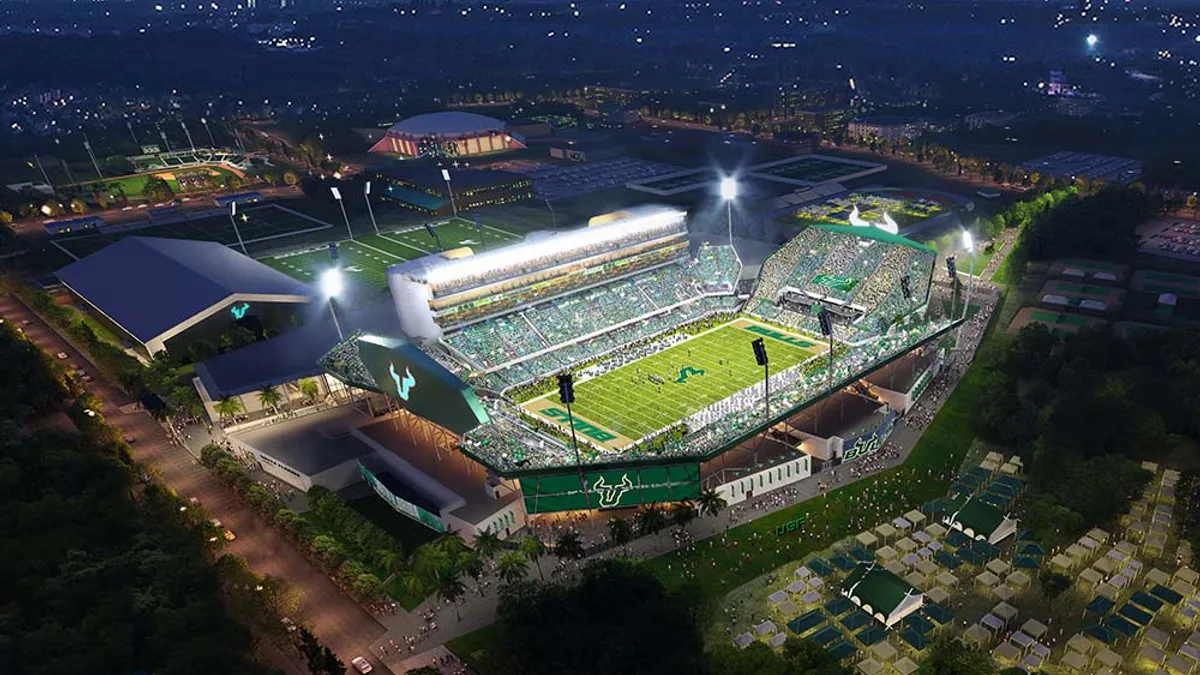 A rendering displays the overhead view of a football stadium at night,