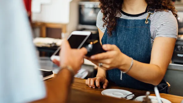 Client pays contactless at coffeeshop