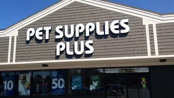 A grey Pet Supplies Plus storefront with white wording on it.