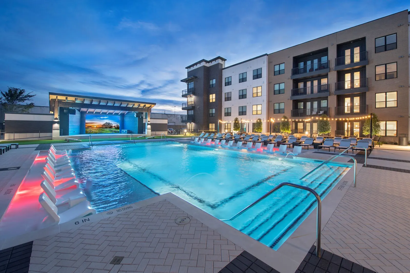 A pool with a stage at the opposite end.