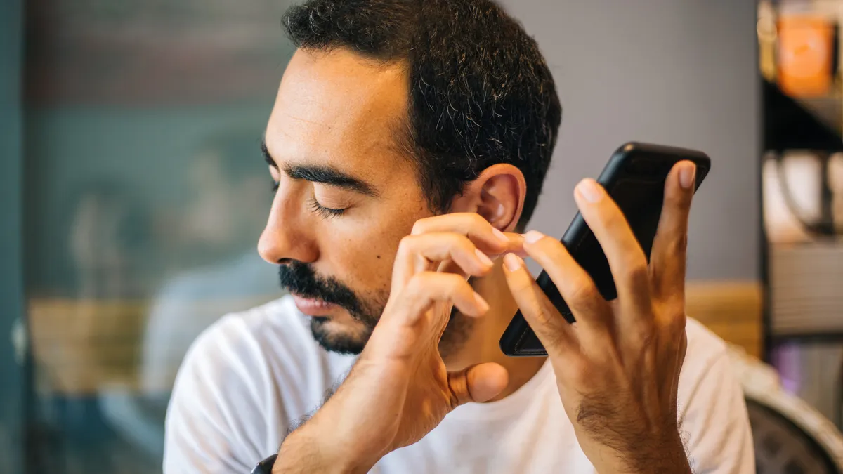 Blind man using technology