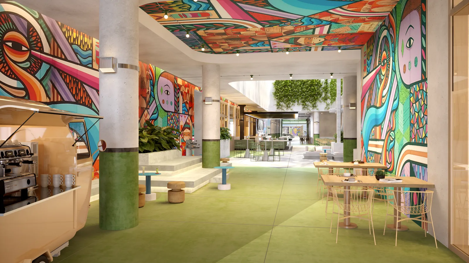 A semi-covered passageway with a colorful mural on the wall, a coffee cart, and seating.