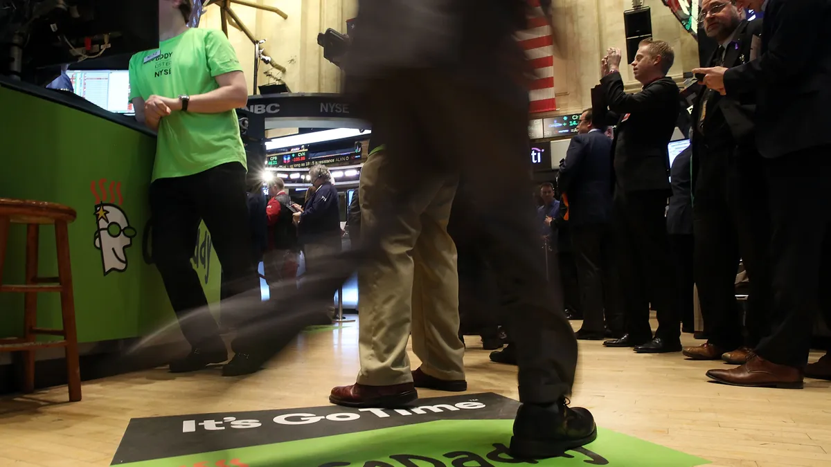 GoDaddy logo depicted on the floor of the New York Stock Exchange