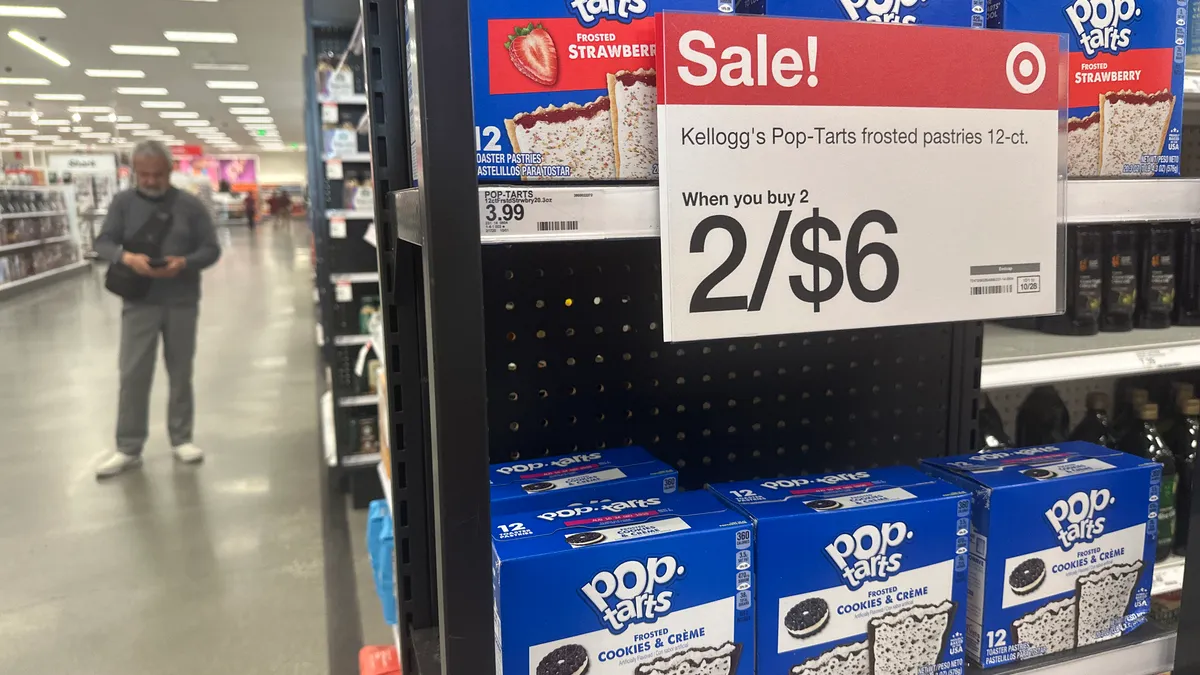 An end display in Target's grocery section features boxes of Pop-Tarts with a sign saying "Sale! Kellogg's Pop-Tarts frosted pastries 12-ct; When you buy 2; 2/$6"