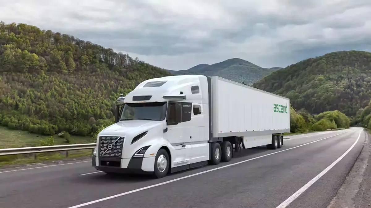 An Ascend tractor-trailer on a road.