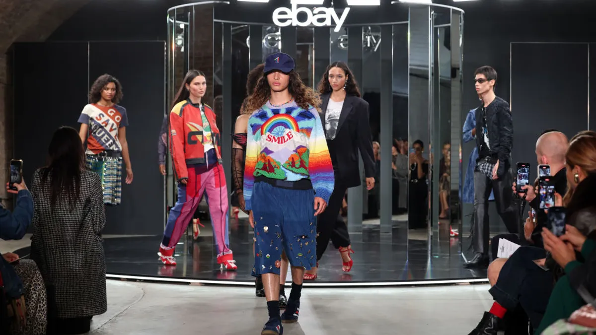 Models walk the runway wearing used items during EBay's Pre-Loved Fashion Week.