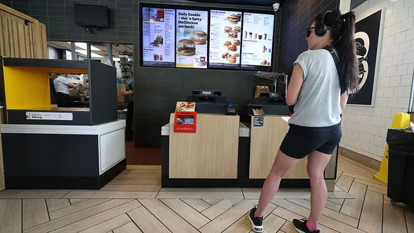 A customer waits on an order in a McDonald's restaurant.