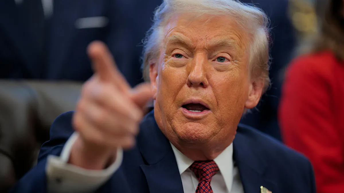 A closeup of President Donald Trump pointing