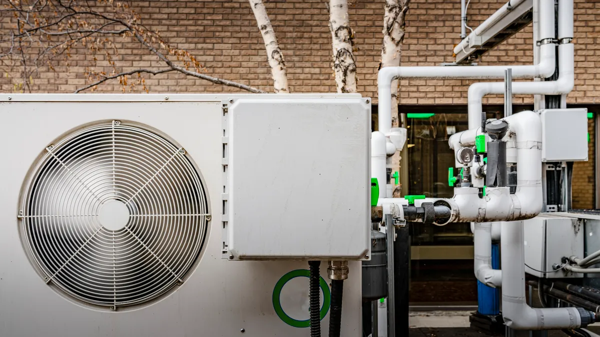 Air compression and heating and ventilation hardware outside a building.