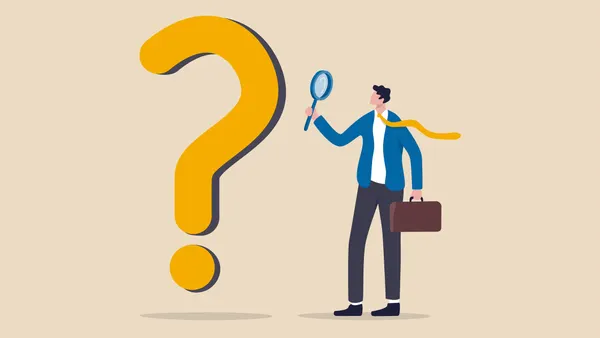 Smart businessman analyst using magnifying glass to analyze question mark sign.