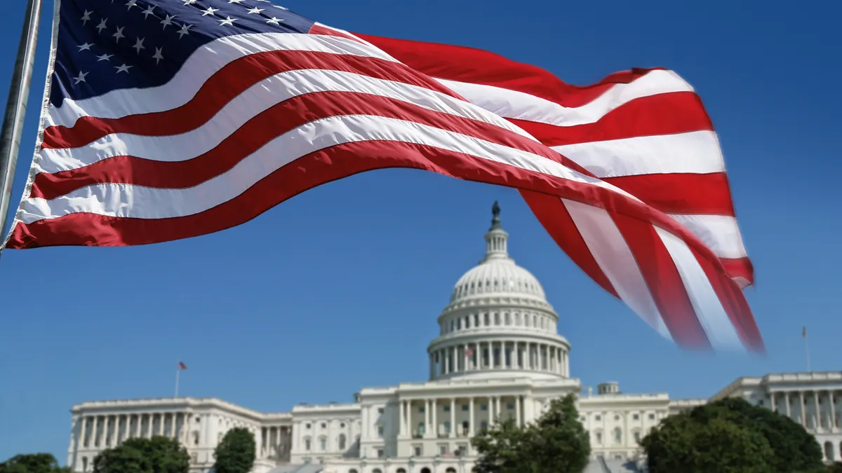 The U.S. Capitol building with an American flag in front