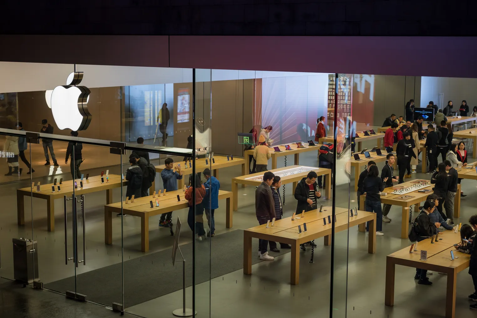 Customers browse inside an Apple Inc. store in on January 3, 2019 in Shenzhen, China.