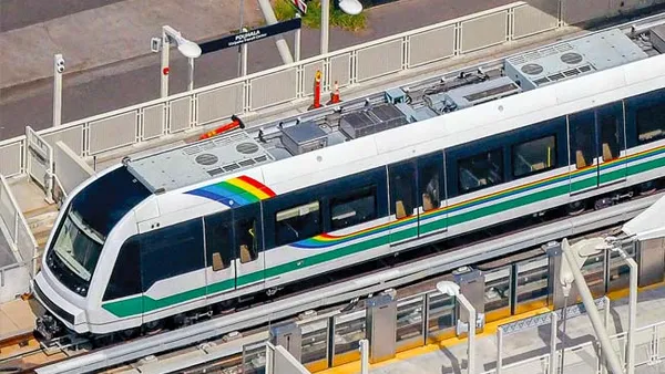 A modern skyline rail train viewed from above.