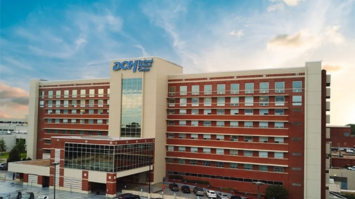 DCH Medical Center is pictured with clouds in the background.