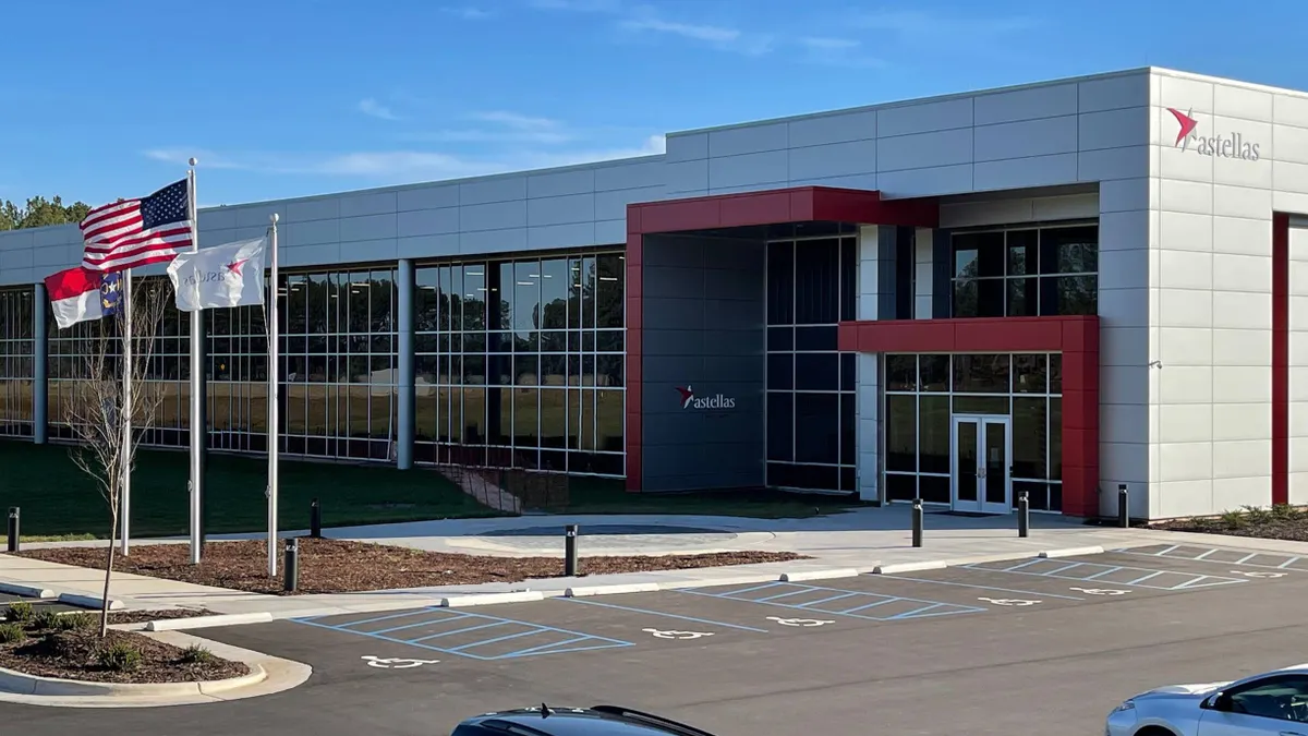 A photo of a building with the Astellas Pharma logo.
