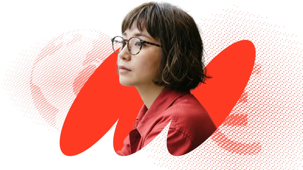 Designed image of woman with glasses and a pixelated globe behind