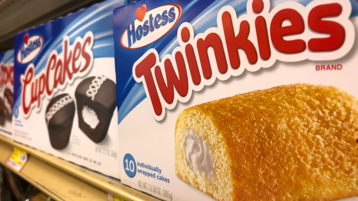 Hostess Twinkies and CupCakes are displayed on a store shelf.