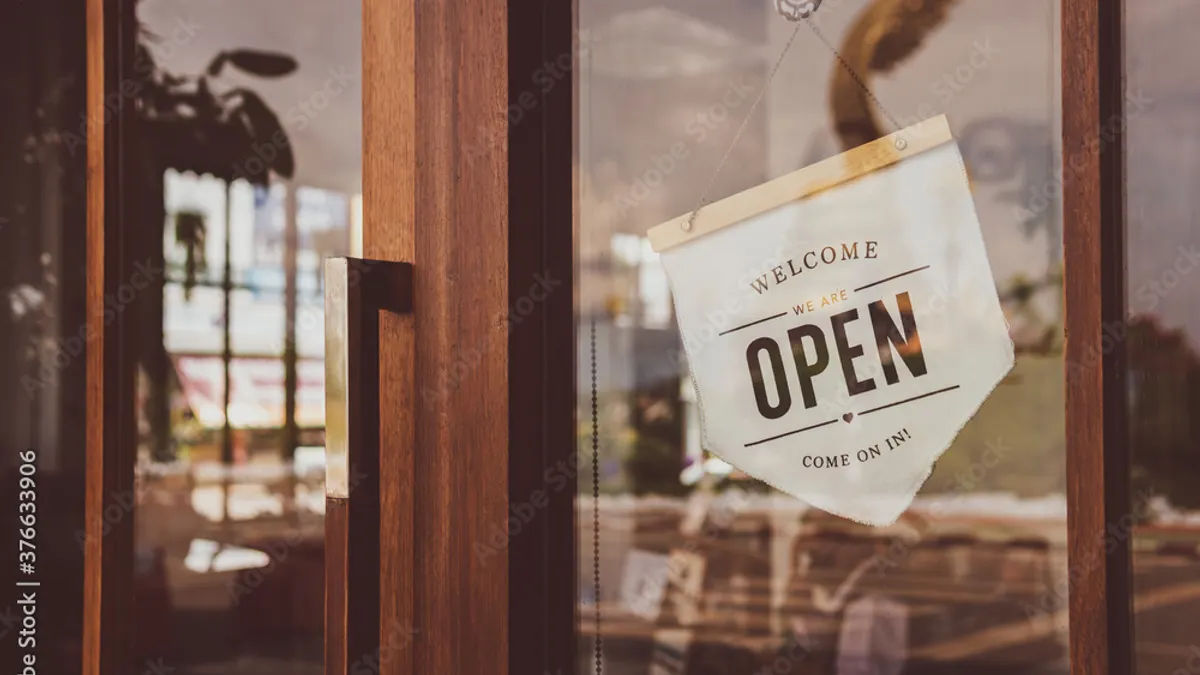 Welcome open sign in local café