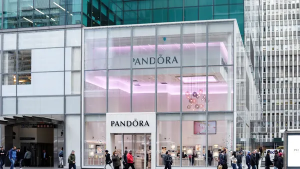 People can be seen walking by the Pandora jewelry store