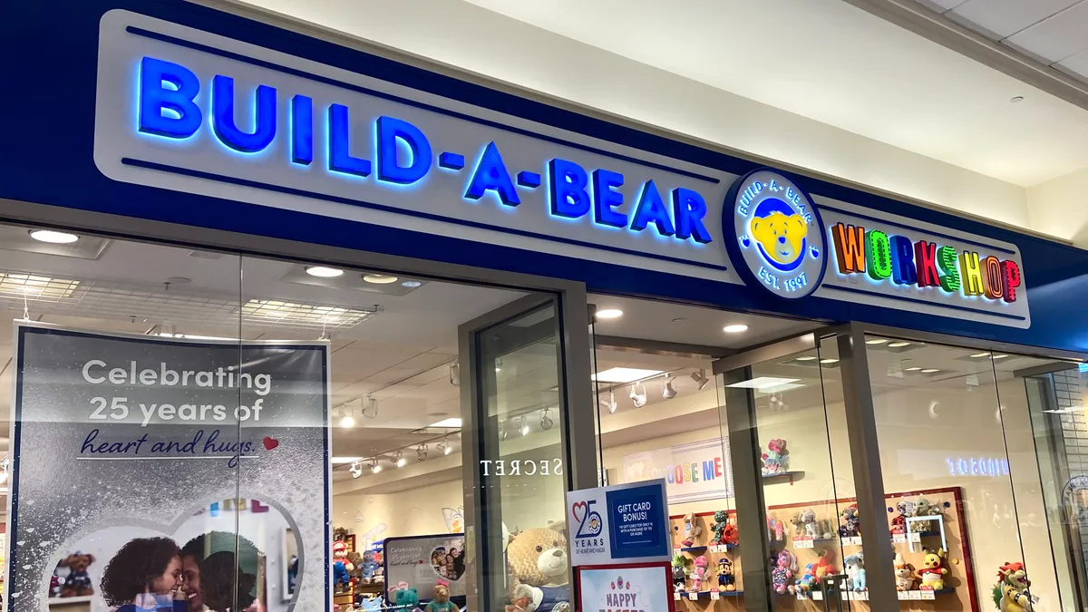 A mall entrance to a Build-A-Bear store, with "workshop" in rainbow-colored letters.