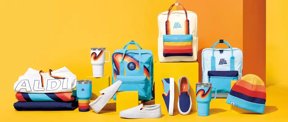 Aldi-branded fan merch including travel mugs, canvas slip-ons, backpacks and pullovers.