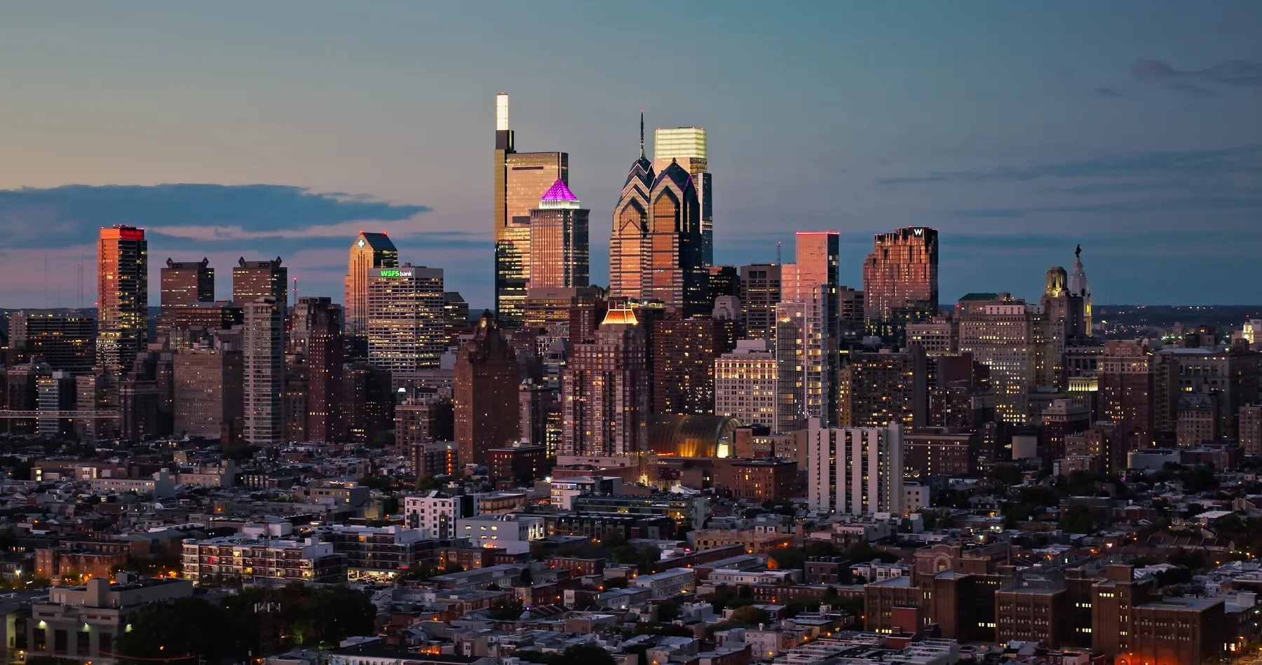 A shot at night of the Philadelphia skyline.