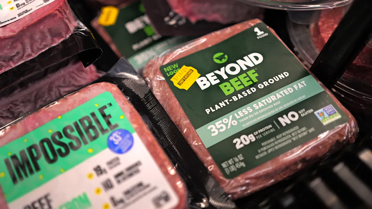 Package of plant-based ground beef are seen in a grocery aisle