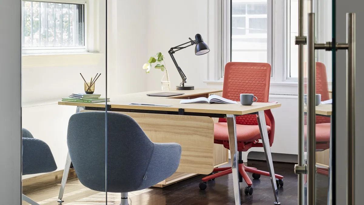 A desk and chairs in an office