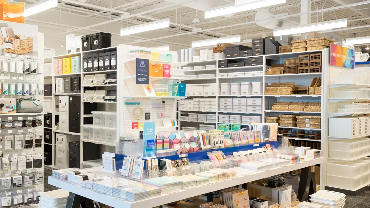A display of office products on a table inside of a Container Store.