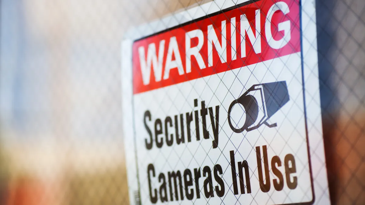 A posted sign warns that security cameras are in use.