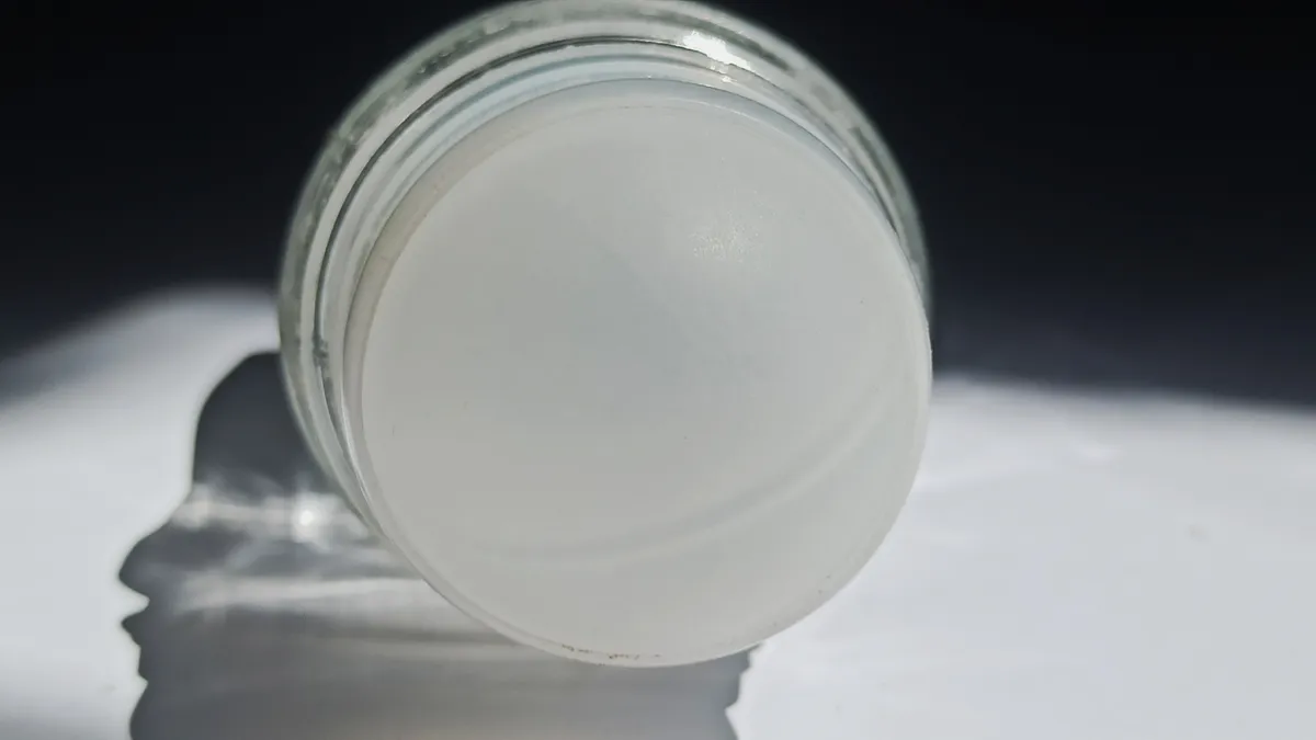 Clear-colored roll-on deodorant on a table