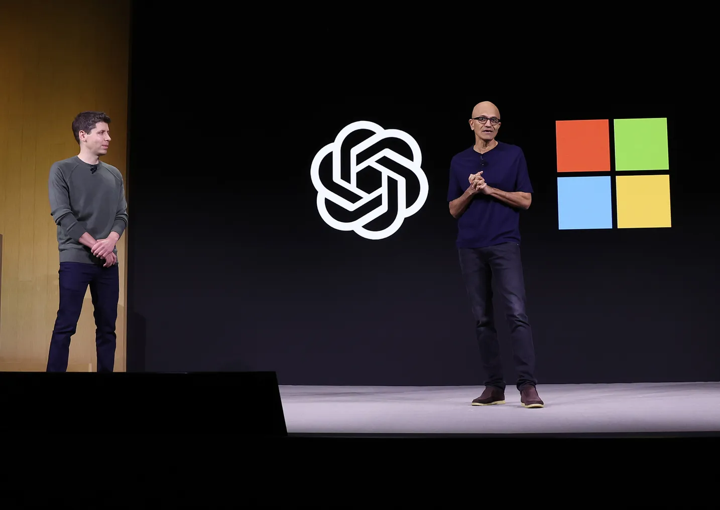 Microsoft CEO Satya Nadella speaks as OpenAI CEO Sam Altman looks on during the OpenAI DevDay event on November 06, 2023 in San Francisco, California.