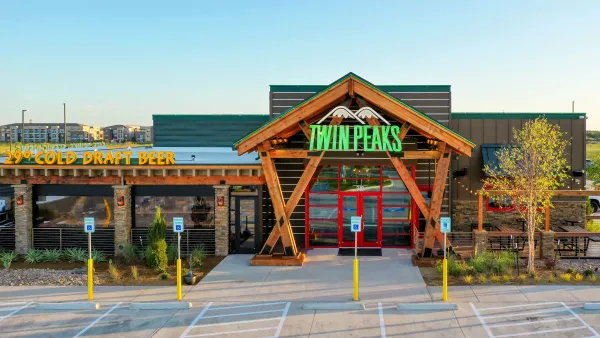 An image of a Twin Peaks restaurant with wooden exteriors.