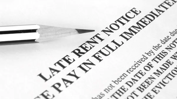 An image of a piece of paper that says late rent notice