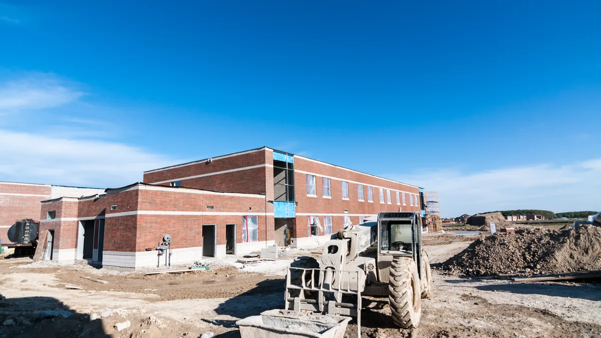 A new elementary school under construction in a suburban neighborhood.