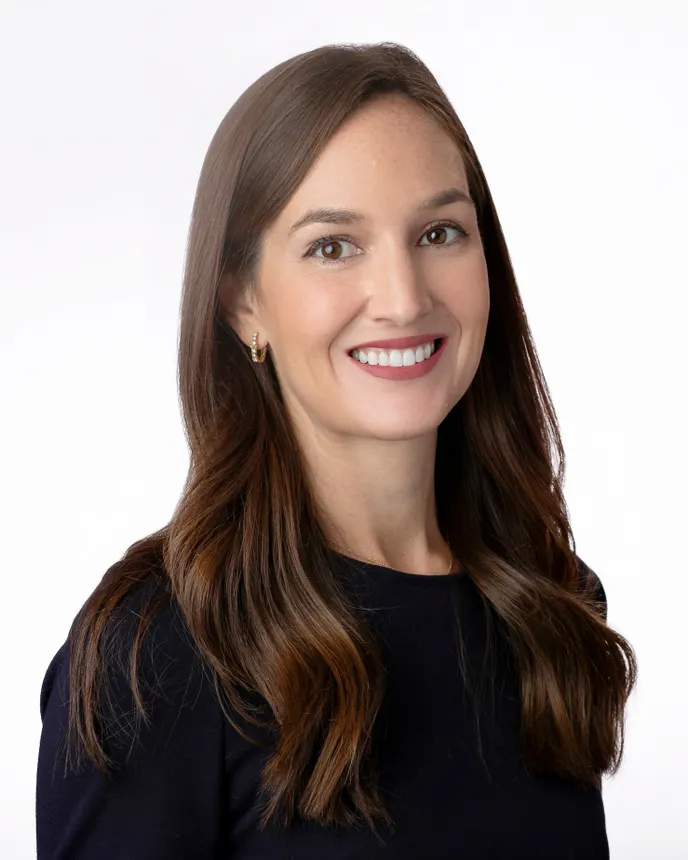 A professional headshot of Caitlin Gossens.