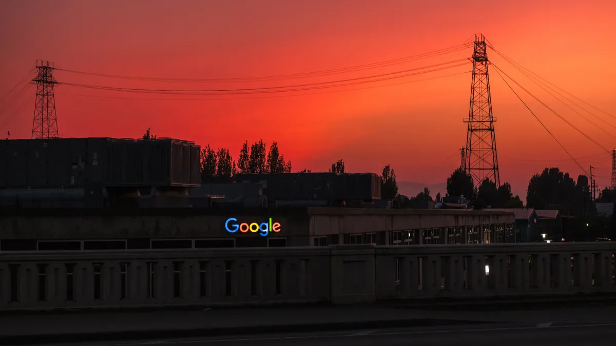 A google sign is illuminated at sunset over the Fremont neighborhood on South Lake Union in Seattle, Washington on July 4, 2023.