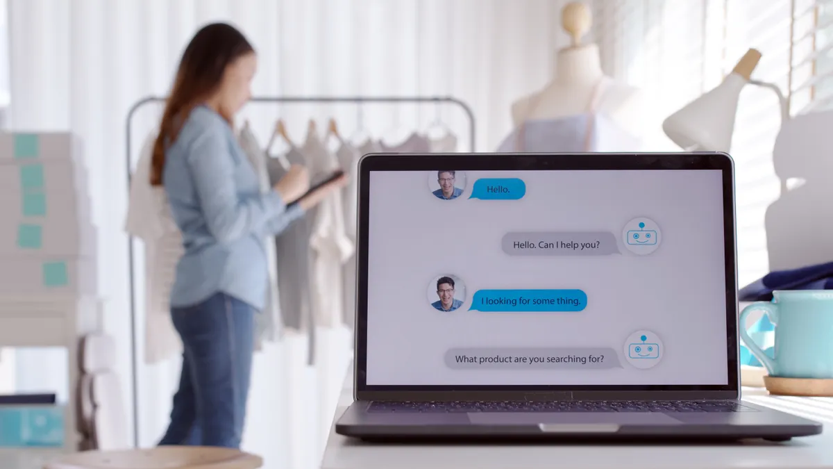 Chatbot conversation on laptop screen app interface with artificial intelligence technology providing virtual robotic assistant customer support and information for small business