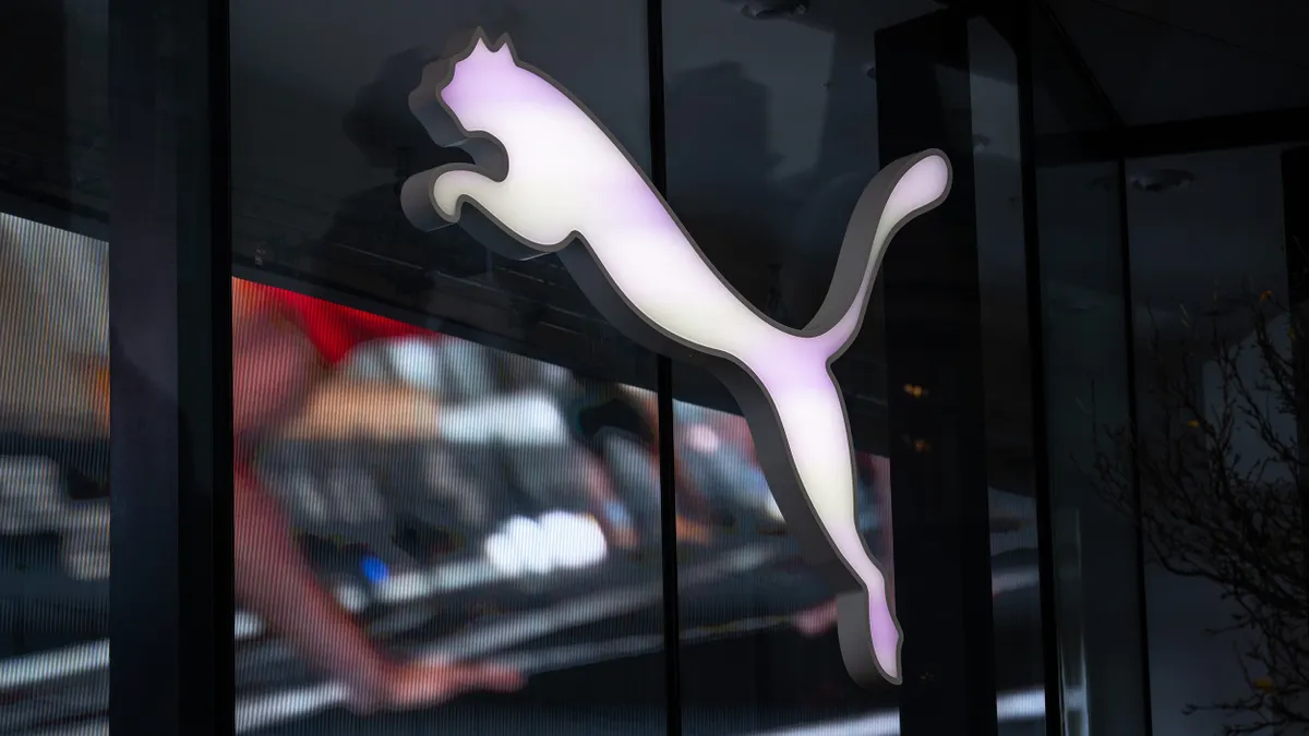 People pass a Puma store on December 9, 2025 in London, Englan