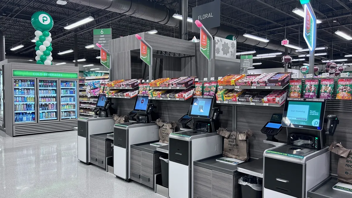 Self-checkout machines at a grocery store.