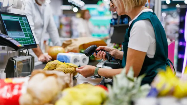 Cashier scanning groceries at the supermarket