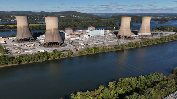 A nuclear power plant sits on an island in a river.