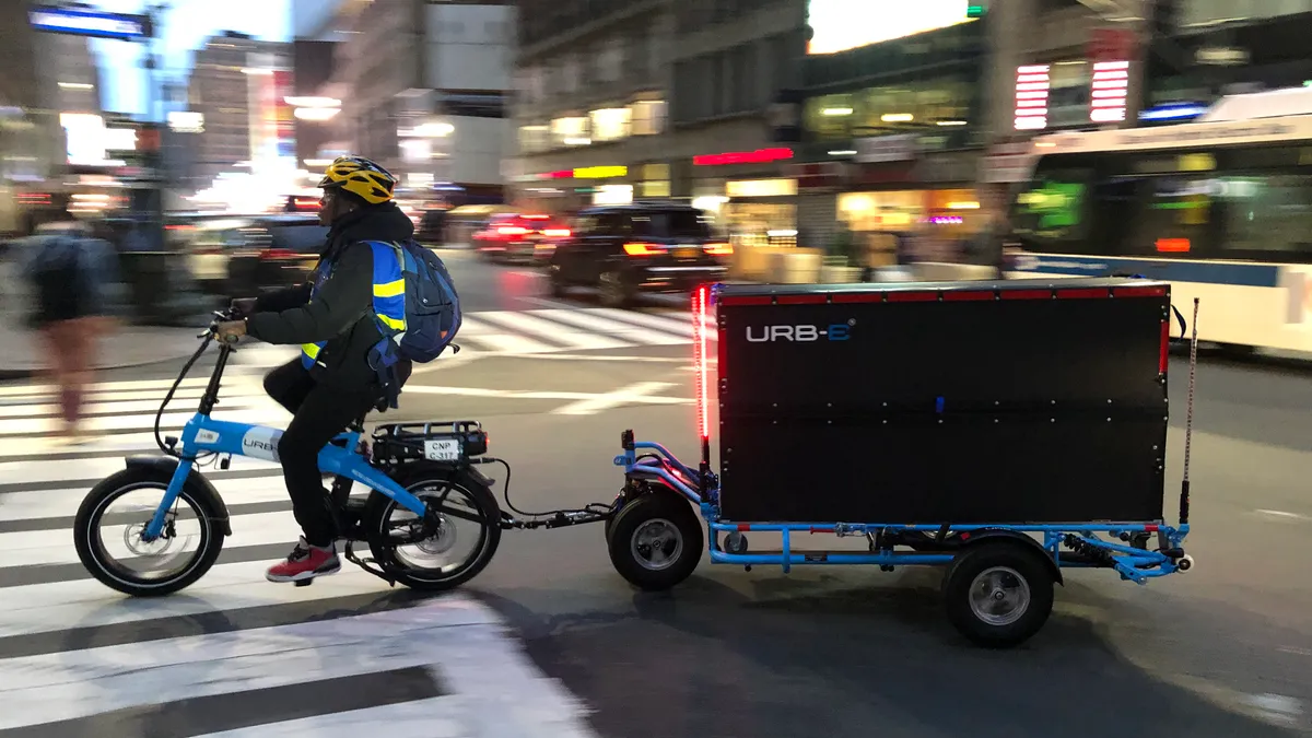 URB-E electric bicycle and container on city street