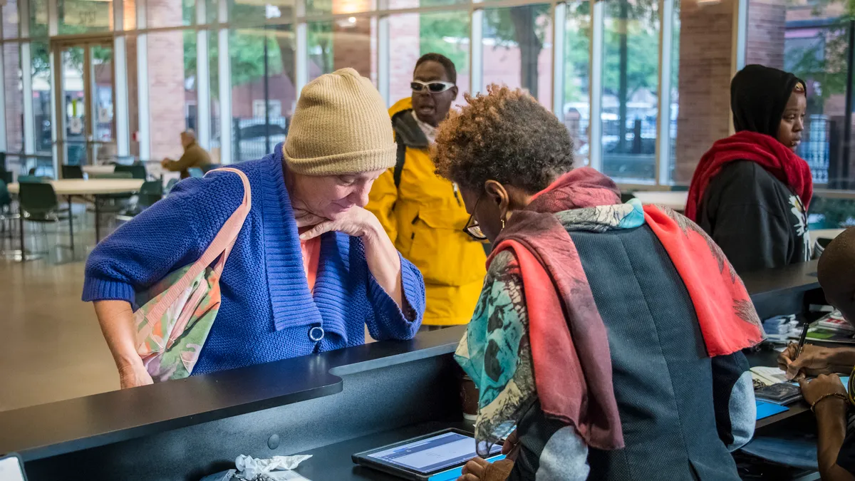 Clients checking in for services at The Beacon, a Houston-based service provider for individuals experiencing homelessness. The organization is part of the Houston region's continuum of care.