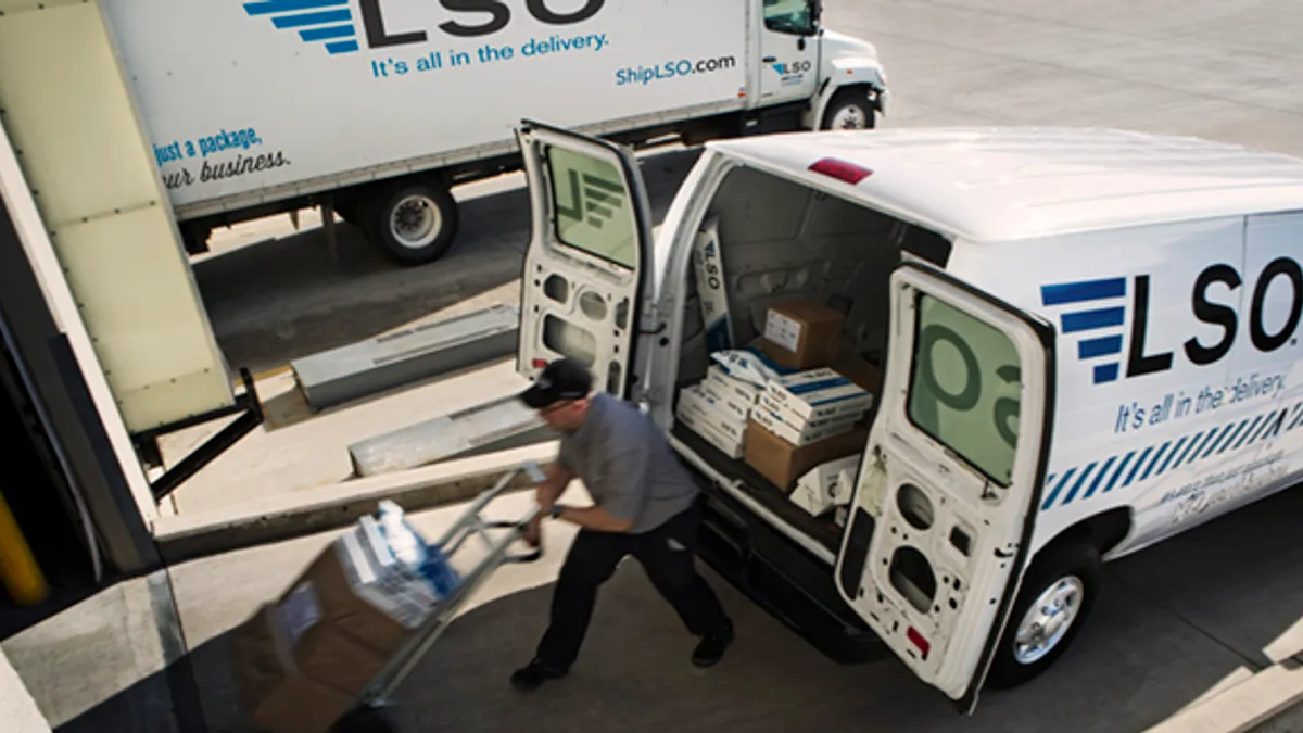 A Lone Star Overnight courier makes a delivery in this undated photo.