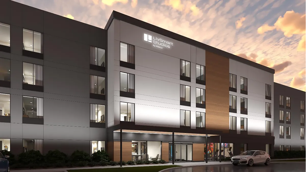 Rendering of the exterior of a LivSmart Studios hotel.