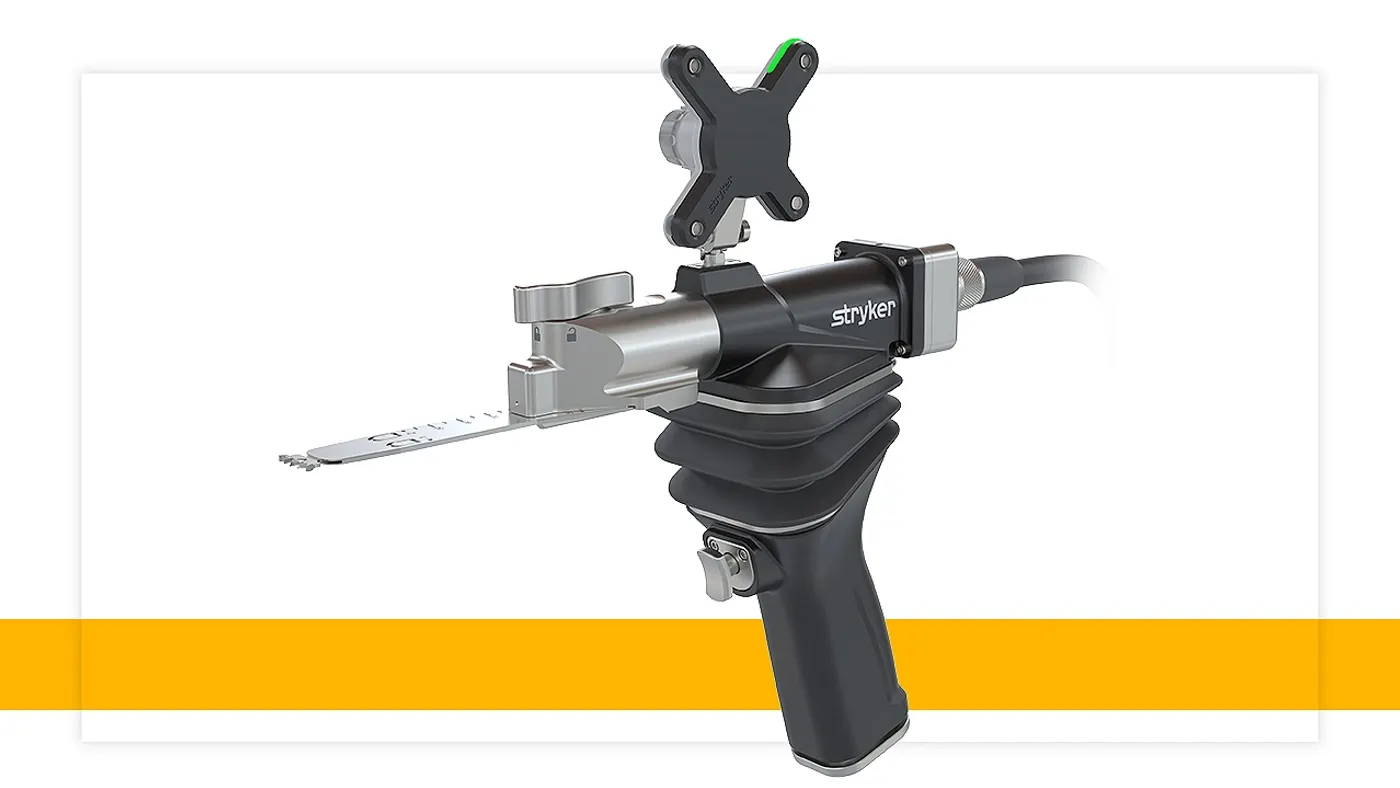A handheld tool with a metal protrusion says "Stryker" on the side.