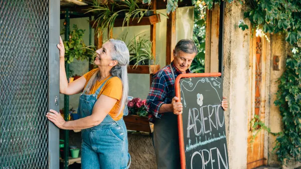 Two people open flower shop