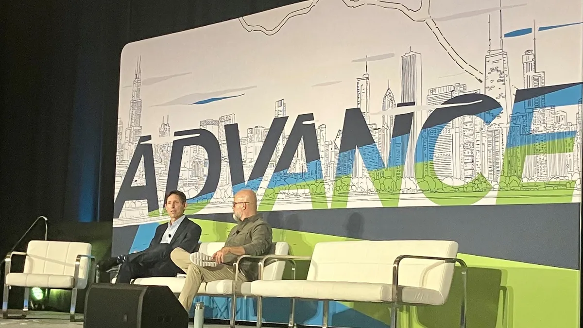 Jeff Fielkow, CEO of Circular Action Alliance, sits and speaks on the SPC Advance stage to the left of Paul Nowak, executive director of GreenBlue