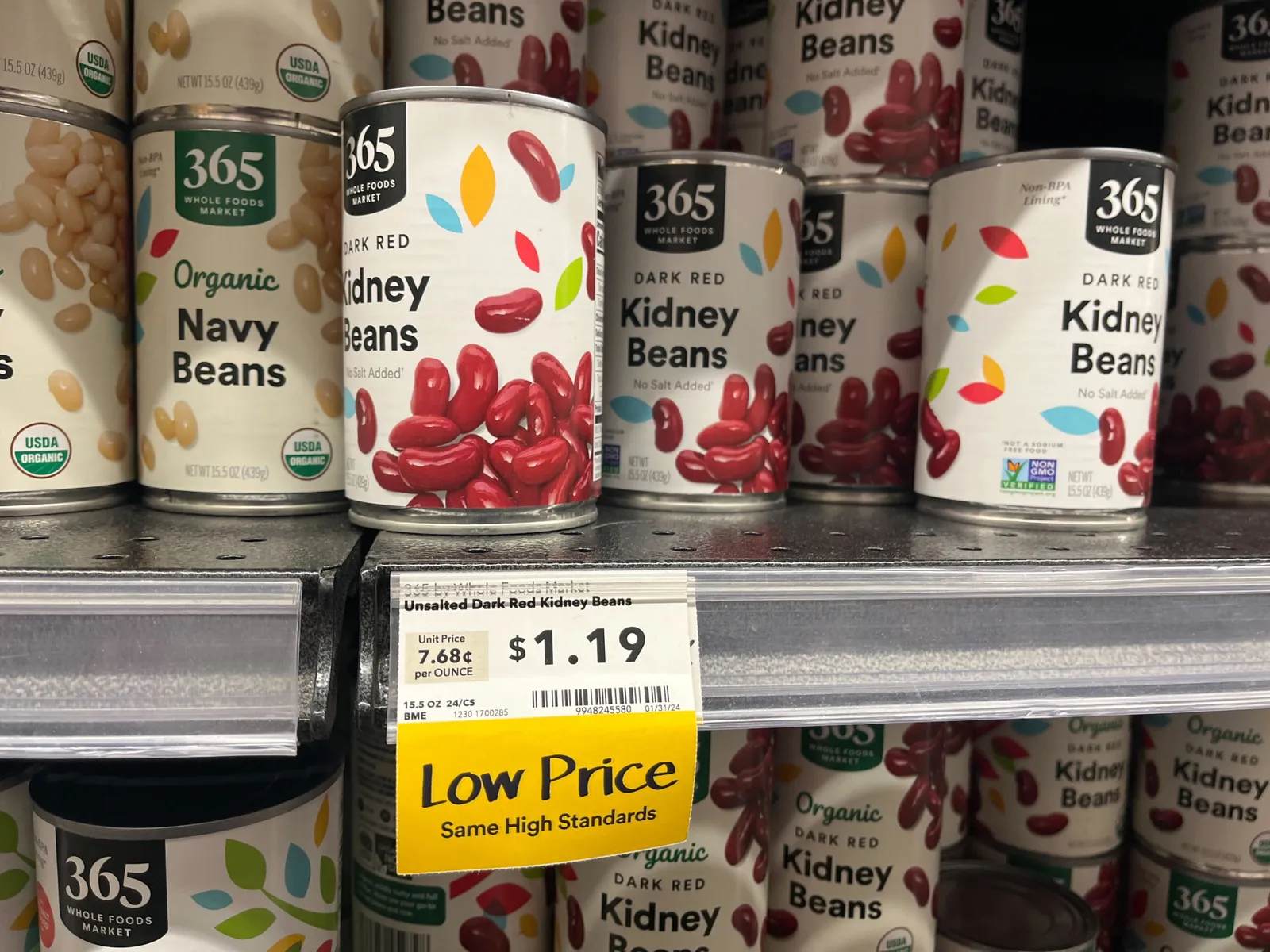 Canned goods at Whole Foods marked as discounted by a yellow tag that reads &quot;Low Price&quot;